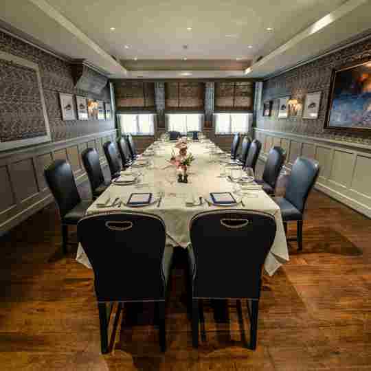 Intimate dining setup with white tablecloths and elegant decor at Bentley’s Oyster Bar, a top fish restaurant in Mayfair.